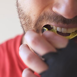 Patient in Concord wearing a mouthguard to prevent dental emergencies